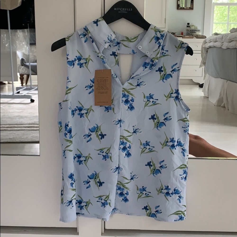New light blue sleeveless blouse